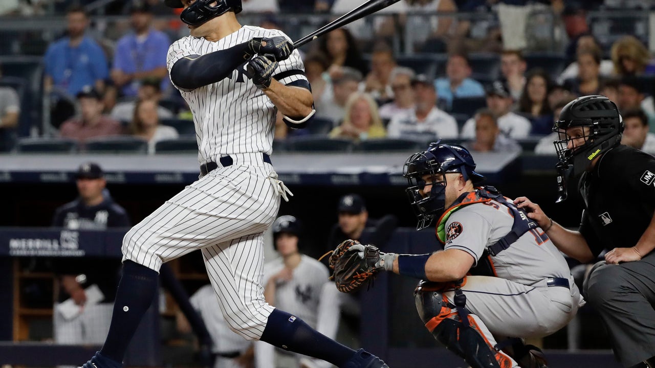 Yanks get key hits off Astros' gloves for 8th straight win